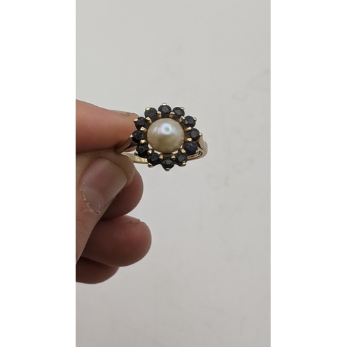 109 - Two gold ladies rings to include a Victorian ring set with seed pearls, stamped 585, 1.1g together w... 