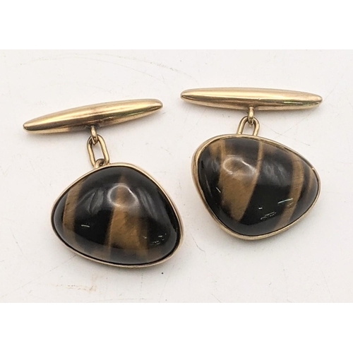 122 - A pair of 9ct gold tiger eye cufflinks, 10.8g
Location:CAB1

If there is no condition report shown, ... 