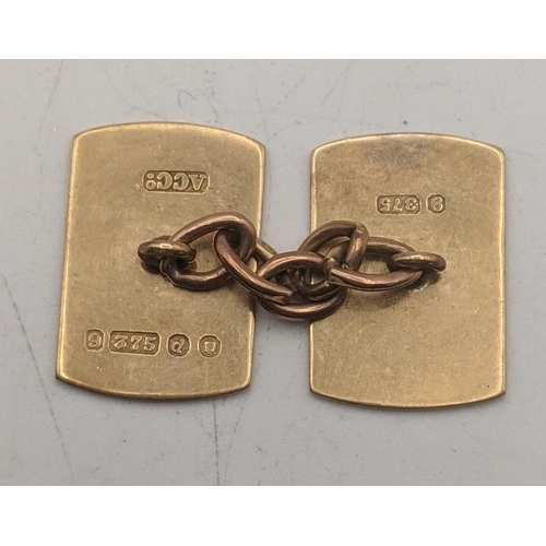 13 - A pair of 9ct gold cufflinks having engraved boarders 4.6g
Location:CAB1
If there is no condition re... 