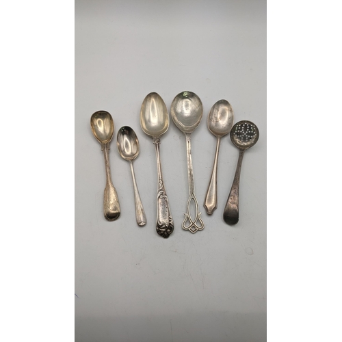 132 - Silver to include three teaspoons, a sugar sifter and three tablespoons, one Sybil Dunlop example ha... 