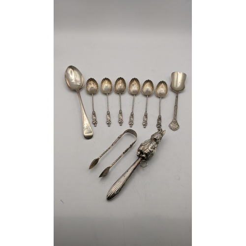 139 - Silver and white meal to include a Peter Rabbit baby rattle A/F, six tea spoons with twisted termina... 