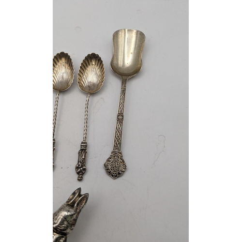 139 - Silver and white meal to include a Peter Rabbit baby rattle A/F, six tea spoons with twisted termina... 