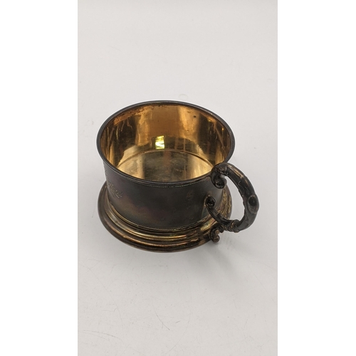 157 - White metal to include continental silver cup holder stamped 800 with engraved decoration, together ... 