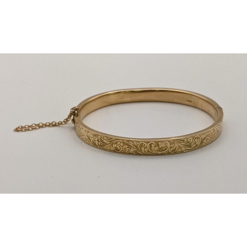 162 - A 15ct gold bangle having floral engraved decoration 8.9g
Location:CAB1
If there is no condition rep... 