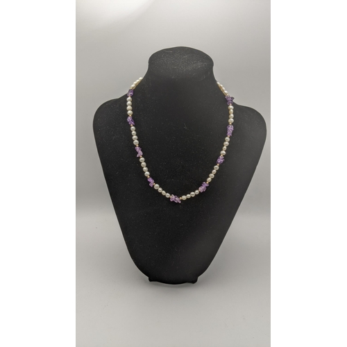 166 - A 9ct cultured pearl and amethyst ladies necklace 42cmL 13.4g
Location:CAB
If there is no condition ... 