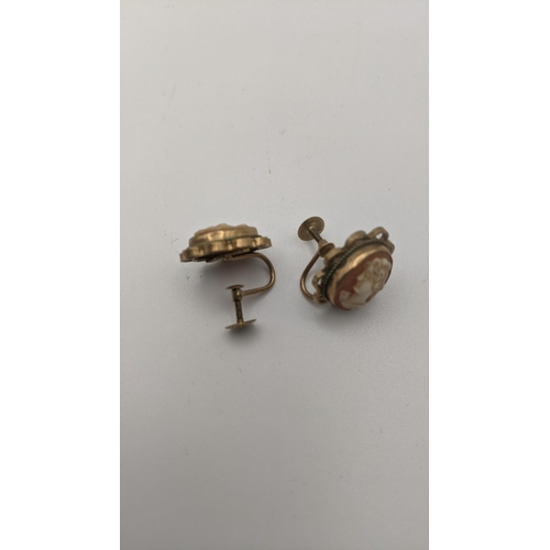 169 - Two pairs of gold earrings to include a pair of 9ct gold cameo earrings and a pair of daisy earrings... 