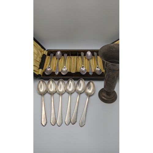 172 - A set of six sterling silver tea spoons 131.3g together with a weighted silver vase and a set of six... 