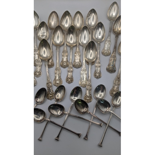 173 - Silver spoons to include a set of 13 fiddle pattern tea spoons to include 7 of them hallmarked Glasg... 