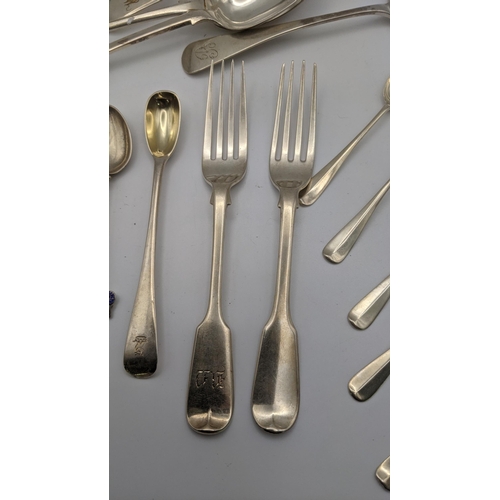 177 - Silver and silver plate to include two silver fiddle pattern forks, a set of six tea spoons, a table... 