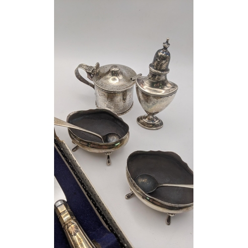 180 - Silver to include a pepper pot, a pair of salts and a mustard pot, and a silver handled bread knife,... 