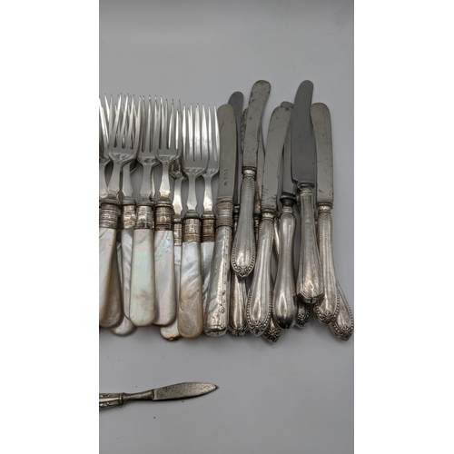 188 - Mother of pearl handled dessert knives with silver ferrules, seventeen silver handled knives and a s... 