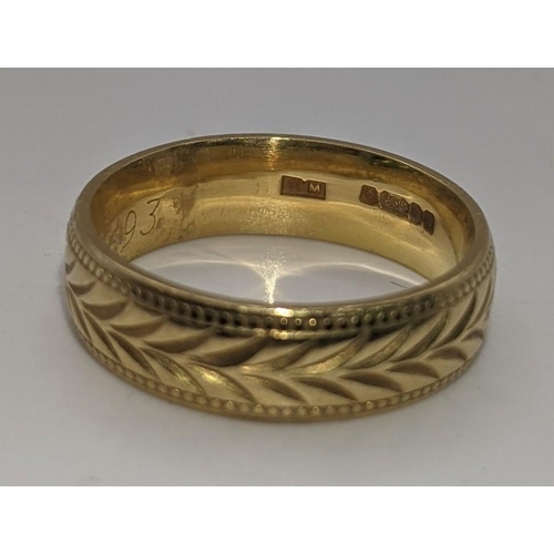 19 - An 18ct gold wedding band having a repeating engraved pattern 6.4g
Location:CAB2
If there is no cond... 