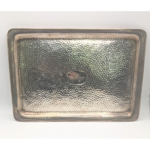 192 - A Synyer and Beddoes silver tray, hallmarked Birmingham 1904, having a hammered decorated base, 30.3... 