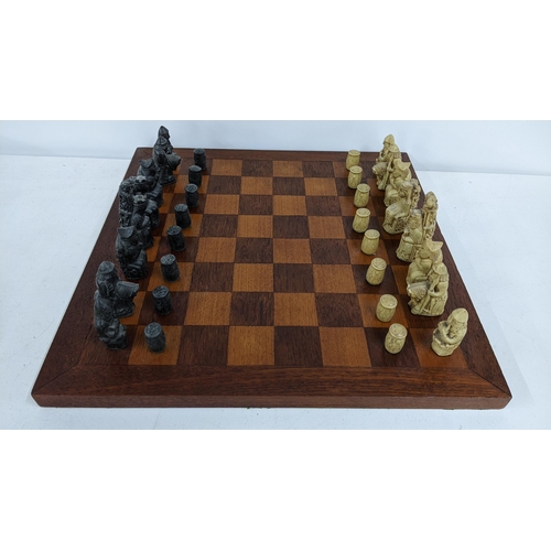 233 - A mid/ late 20th century Resin chess set on an oak board
Location: 9-4
If there is no condition repo... 