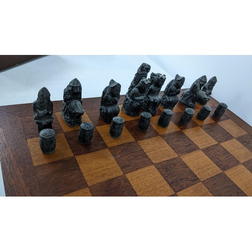 233 - A mid/ late 20th century Resin chess set on an oak board
Location: 9-4
If there is no condition repo... 