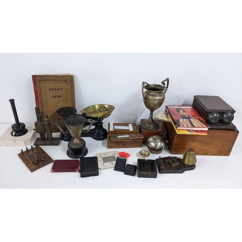 237 - A mixed lot to include weighing scales, silver plated trophies, telephone bell, two boxed sets of bo... 