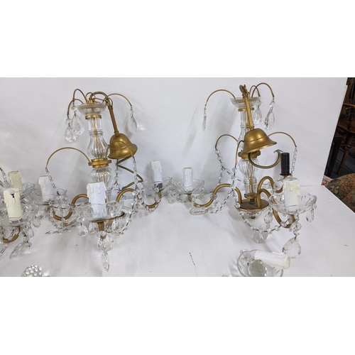 244 - Four mid 20th century gilt metal hanging crystal drop chandeliers
Location: A1B

If there is no cond... 