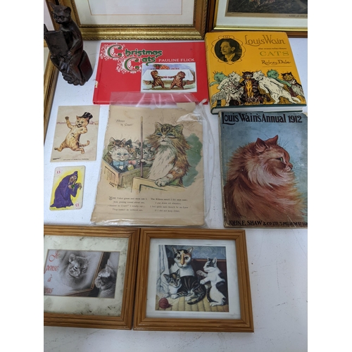 265 - A collection of Louis Wain cat illustrated pictures and ephemera to include early 20th century frame... 