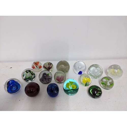 268 - A selection of glass paperweights to include two signed Adam Jablonski abstract weights, a Whitefria... 