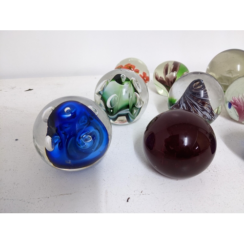 268 - A selection of glass paperweights to include two signed Adam Jablonski abstract weights, a Whitefria... 