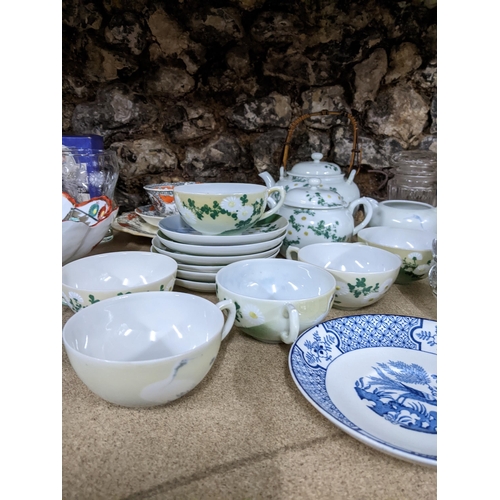 270 - A mixed lot of ceramics and glassware to include a Japanese tea set decorated with flowers and crane... 