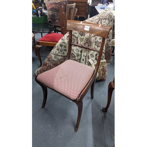 302 - A set of six Regency mahogany bar back dining chairs together with a reproduction dining table with ... 