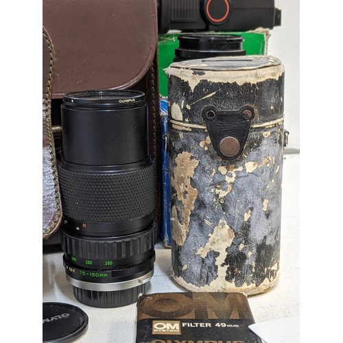 326 - Olympus photographic equipment to include an Olympus OM-1, a 75-150mm Olympus telephoto lens, a Vivi... 