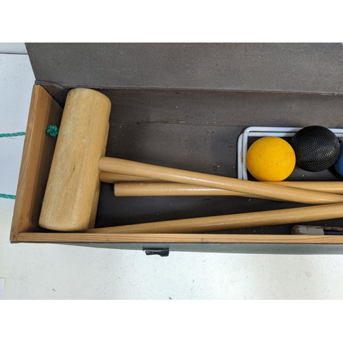 329 - A boxed Jaques croquet set comprising four mallets and balls, some hoops and other items Location: A... 