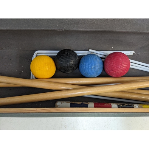 329 - A boxed Jaques croquet set comprising four mallets and balls, some hoops and other items Location: A... 