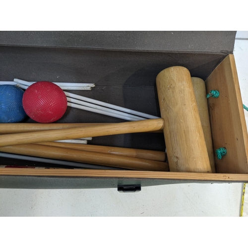 329 - A boxed Jaques croquet set comprising four mallets and balls, some hoops and other items Location: A... 