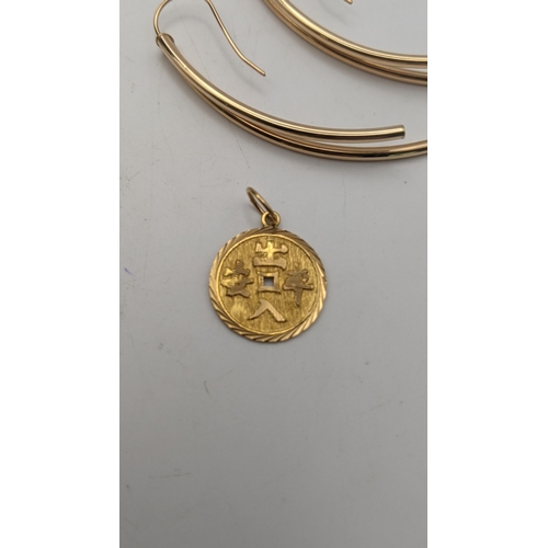 33 - A Chinese gold pendant 1.9g and a pair of Italian 9ct gold earrings 1.45g
Location:CAB1
If there is ... 