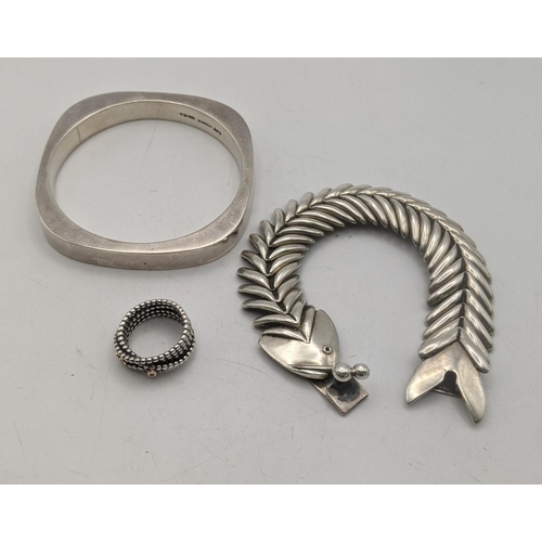 72 - Silver jewellery to include a fish bracelet, a bangle and a ring total weight 104g
Location:A3M
If t... 