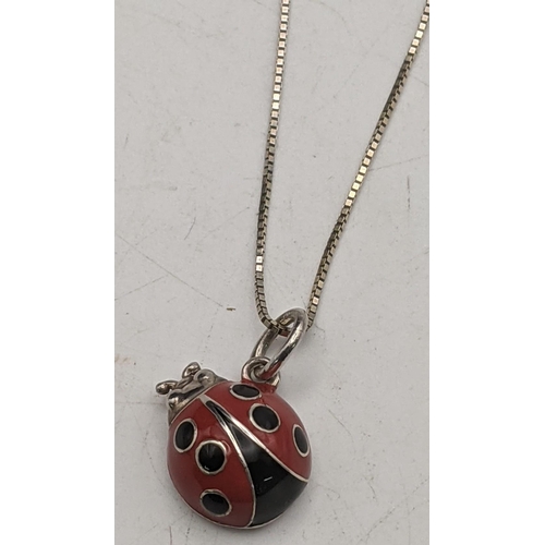 73 - A Tiffany silver and enamelled lady bird pendant and two necklaces total weight 8.6g
Location:CAB1
I... 