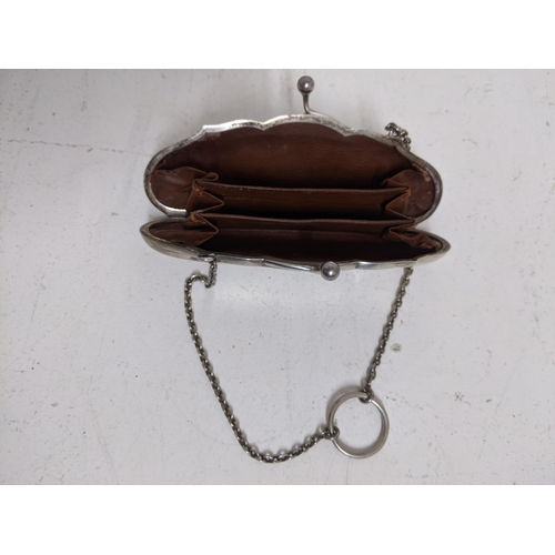 86 - A George V silver ladies purse with leather fitted interior on a chain and suspension ring, Birmingh... 