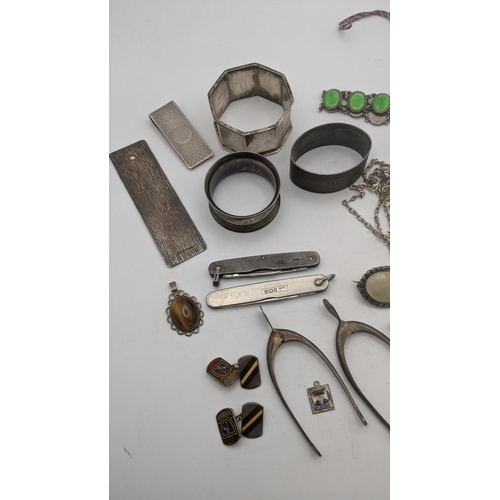 97 - Mixed silver and white metal to include three napkin rings, a sterling silver and enamel bracelet, t... 