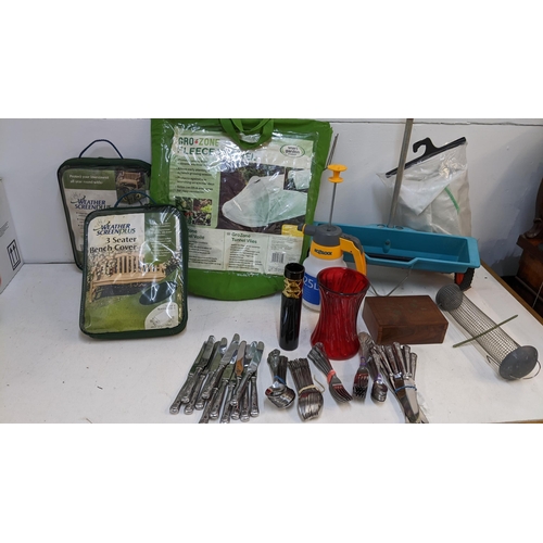 199 - Garden and home related items to include a cutlery and flatware set, bench covers, a folding table a... 