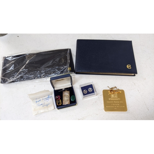 202 - Collectables to include a Wimbledon silver pendant, a Habib Bank Zurich commemorative paperweight, a... 