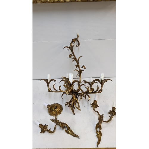 205 - A gilt metal chandelier fashioned as leaves and a pair of similar wall lights
Location: G

If there ... 