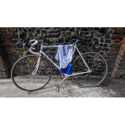 262 - A Pinarello Banesto racing bike, early 1990s in the Banesto colours original equipment, wit matching... 