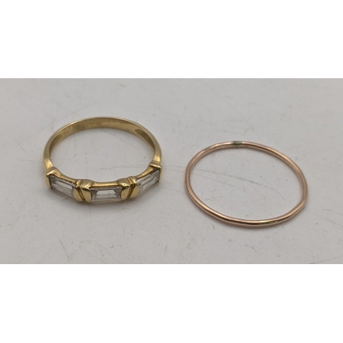 149 - Gold coloured rings, one set with paste stones, tested as 18ct, 2g, and another tested as 9ct, 0.5g
... 