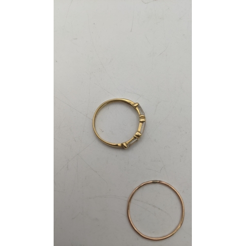 149 - Gold coloured rings, one set with paste stones, tested as 18ct, 2g, and another tested as 9ct, 0.5g
... 