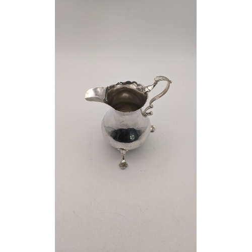 119 - A George III silver cream jug, hallmarked London 1767, 80.6g, makers mark A.N.SA
Location:T

If ther... 