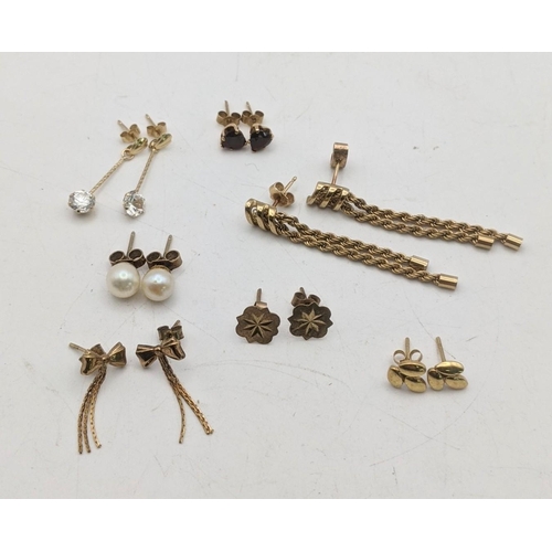 142 - Mixed 9ct gold and yellow metal earrings to include a pair of rope twist tassel earrings, a pair of ... 