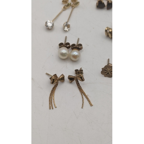 142 - Mixed 9ct gold and yellow metal earrings to include a pair of rope twist tassel earrings, a pair of ... 