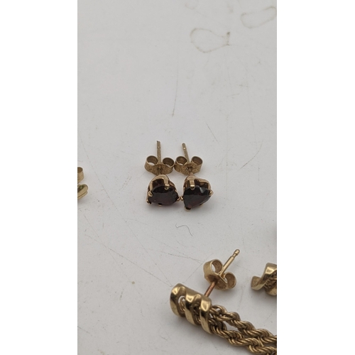 142 - Mixed 9ct gold and yellow metal earrings to include a pair of rope twist tassel earrings, a pair of ... 