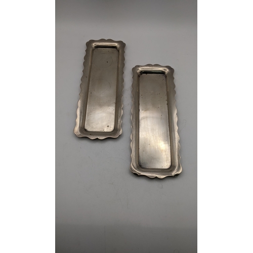 153 - A pair of silver condiment trays with wave shaped boarders, 197.7g
Location:A2B

If there is no cond... 