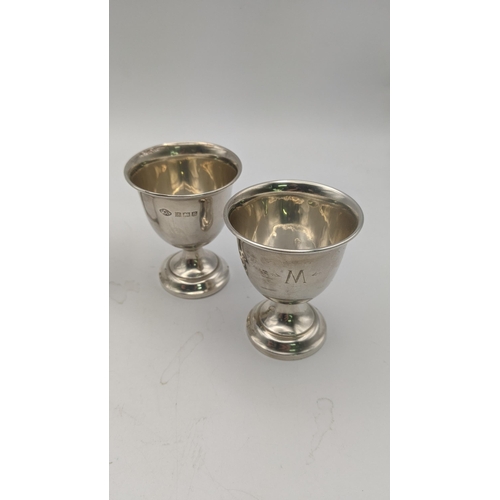 156 - Silver to include a pair of egg cups, a toast rack hallmarked Birmingham 1932, together with four sp... 