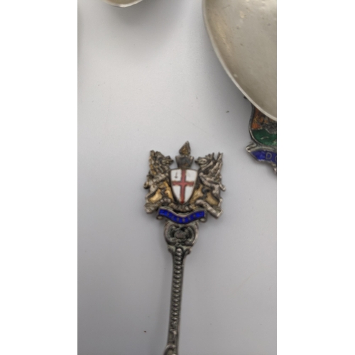 202A - Eleven silver collectors tea spoons, some with twisted terminals and decorated with enamel, to inclu... 