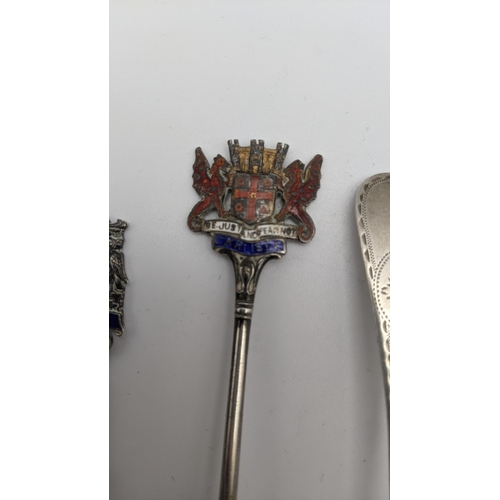 202A - Eleven silver collectors tea spoons, some with twisted terminals and decorated with enamel, to inclu... 