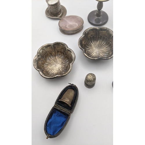 206A - Mixed silver items to include a pair of embossed pin dishes, a silver picture frame, mother of pearl... 